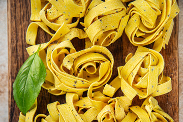 pasta raw tagliatelle with chia seeds dish fresh tasty gourmet food background On the table rustick food top view copy space