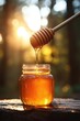 © Lubos Chlubny - Honey dripping into jar on sunny day in the forest