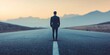 © Oatkhaphon - A solitary figure in a suit stands on an empty road, symbolizing journey, reflection, and determination against a serene backdrop.