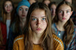 © los_ojos_pardos - An image of a teen girl with long brown hair and acne on her face, wearing a mustard yellow sweater.