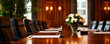 © Weerapat - Elegant conference room with a long wooden table, leather chairs, and a beautiful flower arrangement, perfect for business meetings.