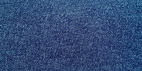 Blue denim fabric texture with diagonal weaving patterns and soft lighting, creating a classic and rugged look, ideal for fashion, textile design, or background concepts for creative projects
