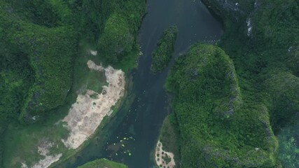 Wall Mural - Jungle, river and drone on mountain with forest, woods or landscape in countryside in Vietnam. Green, bush and rocky environment with water, lake or growth in nature and conservation of wetland