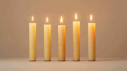 A row of five white candles sitting next to each other.