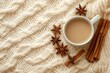 © Mikhail Vorobev - Cozy autumn or winter flat lay  coffee cup, cinnamon, anise stars on cream knit blanket