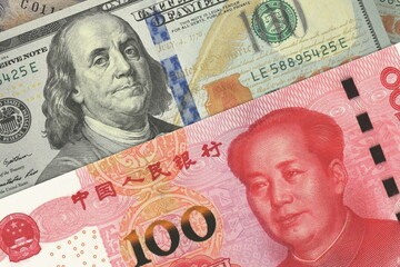 Chinese Yuan and US Dollar Banknotes. Cash. Financial Concept.