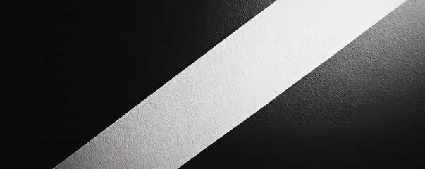 Wall Mural - White stripe dividing black background with rough texture