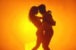 © Fotograf - A romantic moment captured in silhouette form, featuring a couple embracing and kissing on a sunny beach
