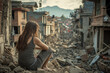 © wernerimages - A woman sits amidst the rubble and ruins of a neighborhood devastated by an earthquake, reflecting on the destruction and loss while contemplating the arduous journey of recovery and rebuilding.