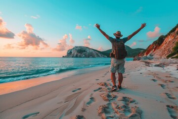 Wall Mural - man with arms raised in joy stands on the beach, freedom and happiness concept