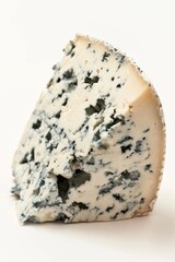 A piece of blue cheese sits on a clean white surface, perfect for photography or culinary purposes