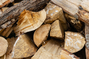 a stack of firewood for heating prepared for the winter