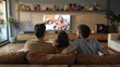 © BonzEarthsnapper - Generate an image of a family watching a TV series on a smart TV, with modern technology and casual, relaxed seating.