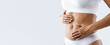 © Prostock-studio - Close up of female beautiful body over grey background, afro woman touching her abdomen, slimming concept