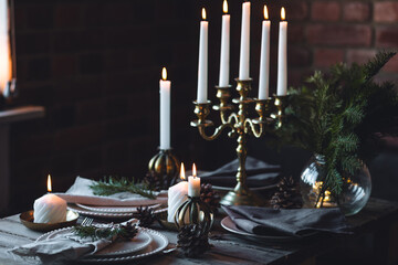 Wall Mural - Rustic Scandinavian style zero waste eco-friendly dinner table decor for Christmas or new year family celebration. Wooden table, natural elements like pine cones, fir tree branches, candles