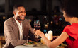 © Prostock-studio - Romantic Date Concept. Loving Afro Spouses Clinking Red Wine Glasses Celebrating Anniversary Of Marriage In Fancy Restaurant. Selective Focus