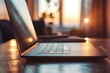 © Studium L&M - Warm sunset light on modern laptop in cozy indoor setting, highlighting technology and comfort.