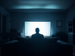 © Michael - A man sitting on a bed and watching erotic film in the television in the dark. Adult films addiction