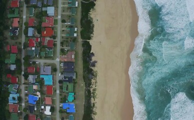 Wall Mural - Drone, beach and road with house for holiday, trip or vacation to coast for relaxing. Aerial view, travel and calmness in Cape Town neighborhood for fun, adventure or peaceful on shore, sea and sand