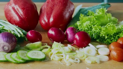 Poster - Organic nutrition concept. Close up of assorted fresh natural vegetables on kitchen table