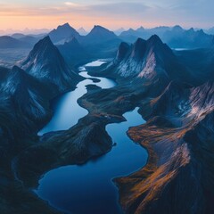 Wall Mural - Aerial View of a Winding River through Majestic Mountains at Sunset