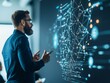 © sorrakrit - A bearded businessman presenting a data visualization on a large screen. He is pointing at the screen with both hands.