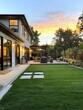 © K silver - Modern Home with Lush Backyard and Sunset Sky