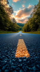 Wall Mural - Winding Road Through Forest at Sunset Photo