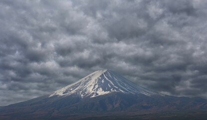 mount fuji on a day when the rain clouds are coming background.