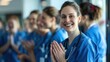© Chanrothana Pech - A nurse being applauded by colleagues for her heroic efforts.