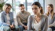 © N7 - Upset Woman Sitting Quietly in Group Session