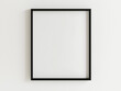 © pattozher - mock up of a black picture frame, isolated on a white background, modern and minimalist style