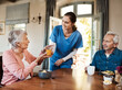 © Malambo/peopleimages.com - Juice, helping and nurse with senior couple in assisted living facility with healthy breakfast for nutrition. Happy, talking and caregiver with elderly patients for fruit drink in retirement home.