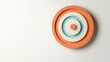 © Galib - A pastel colored target on a white background.