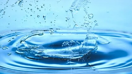 Wall Mural - Aqua Symphony: Water droplet impact, ripples, splash, and spray.  A mesmerizing close-up capturing the fluid dynamics and ethereal beauty of water in motion.