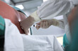 © Alla - The anesthesiologist performs an epidural anesthesia on the patient's back. Injections of spinal anesthesia. Unrecognizable persons. The concept of healthcare and medicine. Vascular surgery.