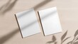 © mangolovemom - Two white sheets of paper are sitting on a wooden table