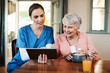© Malambo/peopleimages.com - Tablet, consultation and nurse with senior woman in home explaining nutrition diet for diabetes. Happy, checkup and caregiver with elderly female patient for wellness tracking with digital technology