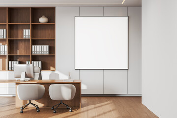 Wall Mural - Modern office interior featuring wooden shelves with binders, a desk with two chairs, and a blank framed poster on the wall. Bright and spacious open space concept. 3D Rendering