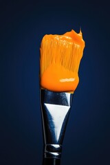 Canvas Print - Orange paintbrush on blue background