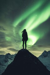 Woman on Snowy Mountain Summit