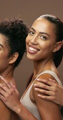 Wall Mural - Women, cosmetics and beauty in studio, together and face with hug, skincare and natural glow by background. Group, model and people with solidarity, closeup and healthy with facial transformation