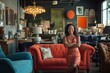 © Gatherina - Confident saleswoman posing with arms crossed in furniture store showroom