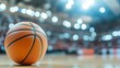 © Matthew - A close-up of a basketball on a court with a blurred background, emphasizing the sport's atmosphere.