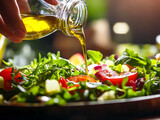 Hand Pouring Olive Oil Over Salad