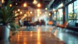 © Terdsak - Modern urban coffee shop interior with blurred background, cozy ambiance, warm lighting, and contemporary design.