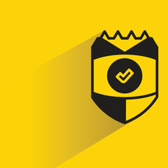 Sticker - shield icon with shadow on yellow background