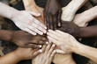 © Irina - diversity concept, of group of diverse people holding hands