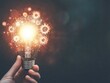 © vanzerim - Glowing Light Bulb with Gears Representing Innovation and Ideas