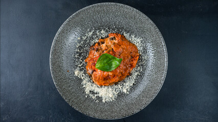 Canvas Print - Braised eggplant with cheese, tomatoes, sauce and basil.